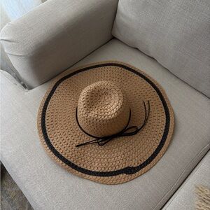 Stylish Tan Straw Hat with Black Trim
